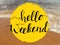 Hello weekend lettering on sea view. Inspirational quote on beach background