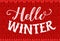 Hello winter text on red knitted texture. Vintage banner with hand lettering. Winter season vector retro card.