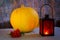Helloween orange lantern, pumpkin and red berry