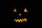 Helloween symbol with mad face, glowing eyes, mouth and teeth