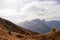 Helm - Alpine meadow in golden autumn with panoramic view of majestic mountain range of untamed Sexten Dolomites