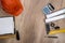 helmet, blank architectural drawing, drawing compass, drawing tools on wood table.