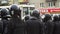 Helmet crowd armed policeman on street close up protect order 4K. Strike people.