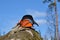 Helmet and gloves on a rock