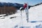 Helmet and Goggles with Skis and Poles on Hillside