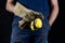 Helmet held by a construction worker. Protective clothing for ma