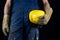 Helmet held by a construction worker. Protective clothing for ma