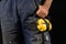 Helmet held by a construction worker. Protective clothing for ma