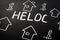 HELOC home equity line of credit loan and homes on the black sheet
