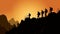 help and improve concept, silhouette people helping other hiker climbing rock and mountain