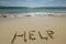 Help Sign on the beach