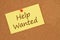 Help wanted message on index card on bulletin board