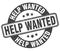 help wanted stamp. help wanted label. round grunge sign