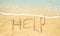 Help written in the sand