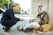 Helpful office worker asking street person about needed food