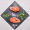 Helpful sports foods, cooking two fresh salmon steak with herbs , spices, top view