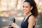 Helping my body achieve greatness. a young woman drinking water during a run.