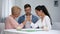 Helpless man looking at mother and wife arm wrestling competition, battle