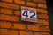 HELSINGOR, ELSINORE, DENMARK: A sign with the house number. Street view in Helsingor