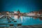 Helsinki, Finland. Bright Blue Starry Sky. View Of Evening City And Uspenski Cathedral From Pier. Light Blue Dramatic