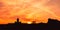 Helsinki, Finland. Dark Silhouette Of Cityscape In Backlit At Sunset