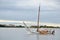 HELSINKI / FINLAND - July 27, 2013: Small sailing boat is cruising arround island near the port of Helsinki