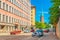 Helsinki - June 2019, Finland: A street with a car traffic, Mikael Agricola Church and colorful residential buildings