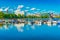 Helsinki skyline, cityscape with old and modern architecture, park, and a lake with boats, Finland