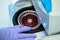 Hematologist in glove removes a cartridge from a laboratory centrifuge