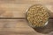 Hemp seeds in glass  bowl on wooden table