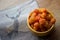 Hemsedal,Norway,18 september 2015 -Cloudberry Rubus chamaemorus close up in orange bowl on napkin with reindeer at