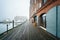 Henderson`s Wharf, on a foggy day in Fells Point, Baltimore, Maryland