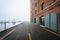 Henderson`s Wharf, on a foggy day in Fells Point, Baltimore, Maryland