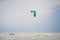 Henichesk, Ukraine - July 12, 2021: Kitesurfing. Practicing kitesurfing at summer beach. Active travel sport recreation.