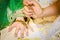 Henna being applied on bride\'s hand