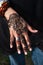 Henna tatto on woman\'s hand trendy floral design