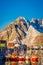 Henningsvaer, Norway - April 04, 2018: Outdoor view of fishing port in Henningsvaer with typical red wooden buildings