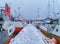 Henningsvaer village in Lofoten islands, Nordland county, Norway, Europe. Ships and boats in marina port in harbor in winter