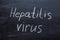 Hepatitis virus text on a chalkboard