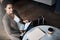 Her business is going places. a young businesswoman reading through a business folder while waiting for her flight in an