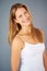 Her happiness is unstoppable. Studio shot of an attractive young woman posing against a gray background.