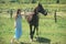 Her most loyal friend. Pretty girl at horse ranch. Adorable horse owner with her pet. Making friends with horse