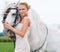 Her most trusted steed will spirit her to the aisle. Portrait of a gorgeous blonde bride standing alongside her stallion