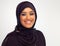 Her smile lights up the room. Studio portrait of a young muslim woman.