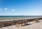 Heraklion coast view benches overlooking the rough sea clear day