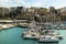 HERAKLION, GREECE - November, 2017: colorful fishing boats and yachts in old Venetian fortress, Heraklion port, Crete