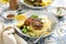 Herb turkey patties served with couscous and fresh salad