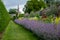 Herbaceous border at Oxburgh Hall, Norfolk UK. Purple Catmint, also known as Nepeta Racemosa or Walker`s Low in the foreground.