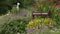 `Herbaceous Border` Sign Among Flowers