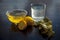 Herbal detoxifying aloe vera tea on wooden surface in a bug transparent jug type glass along with entire ingredients which are ora